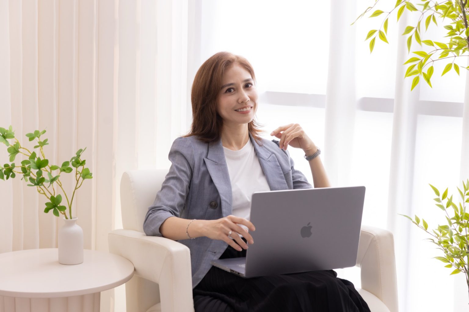 Shirley Krans, Singapore property agent, working at her laptop